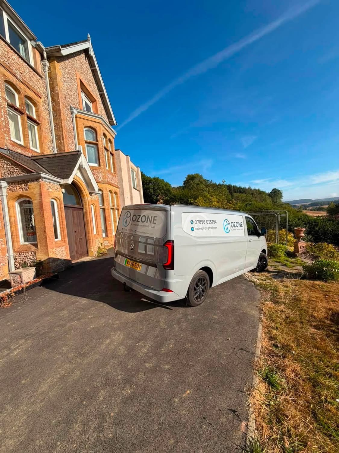 Ozone Plumbing, Heating & Gas van outside a customer's home in Devon